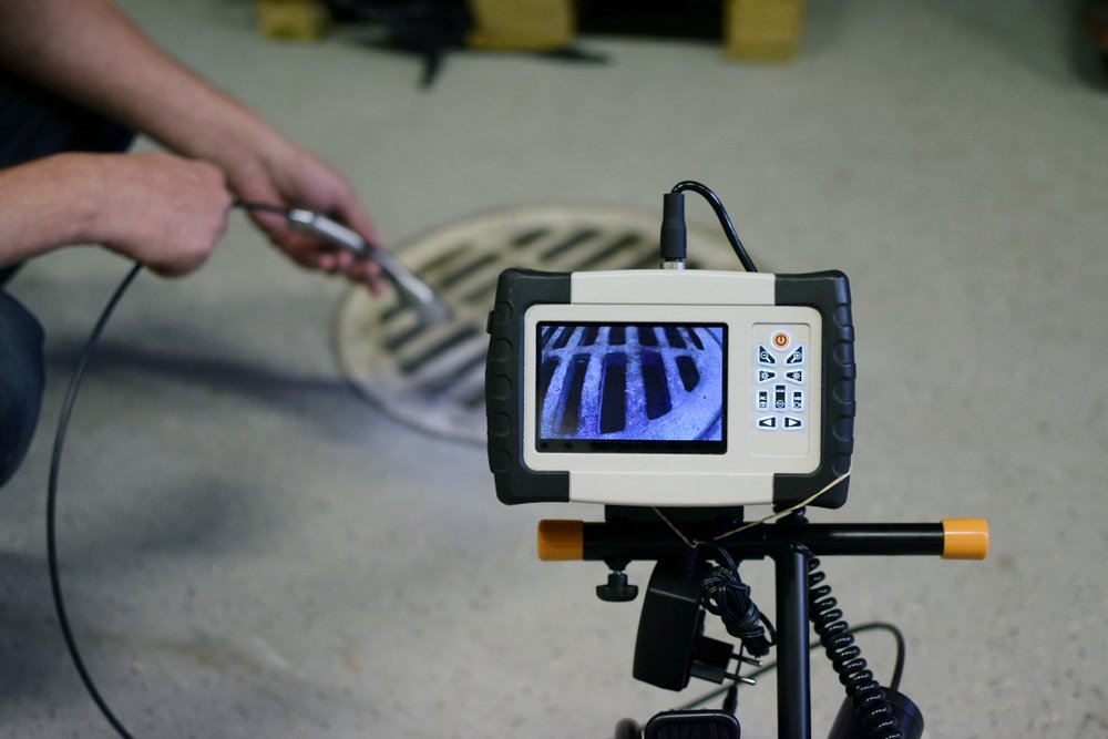 Man,Start,Using,Sewer,Inspection,Camera.,Monitor,Showing,Picture,From septic service